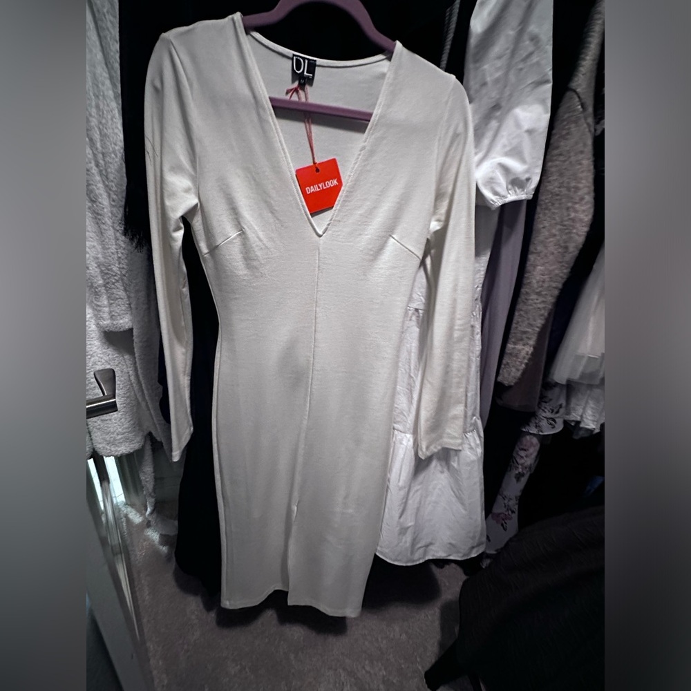 Daily Look new with tags. Off-white bodycon knee length dress with slit. Size M.